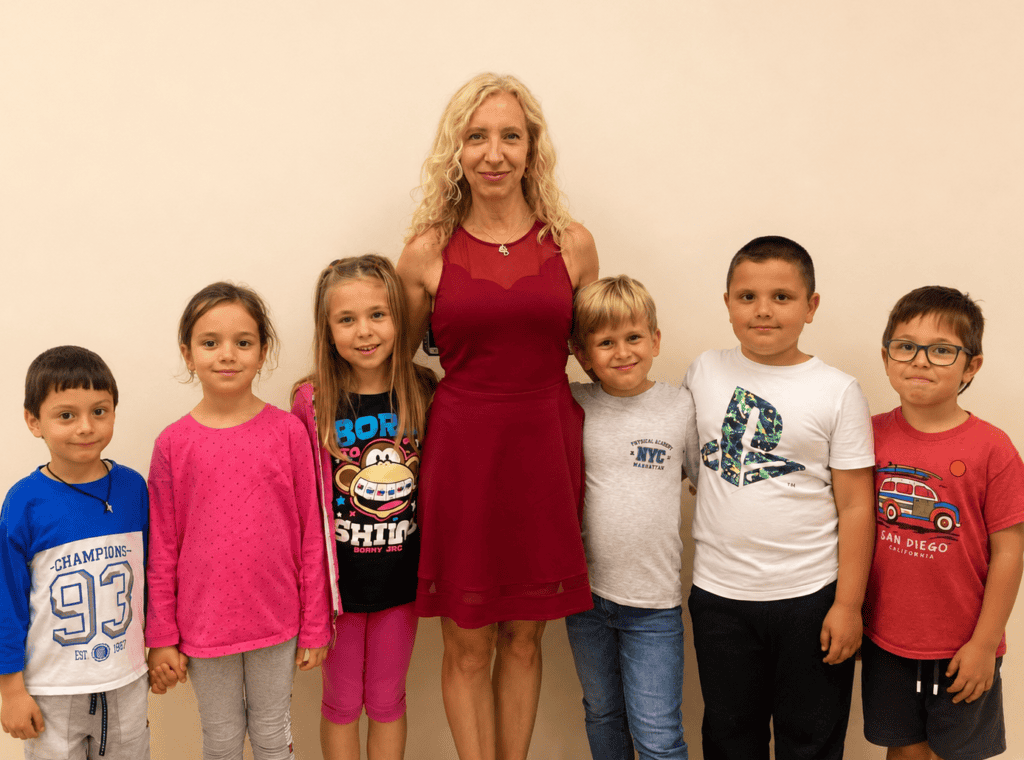 Group of children with teacher at Bulgarian Sunday School class.